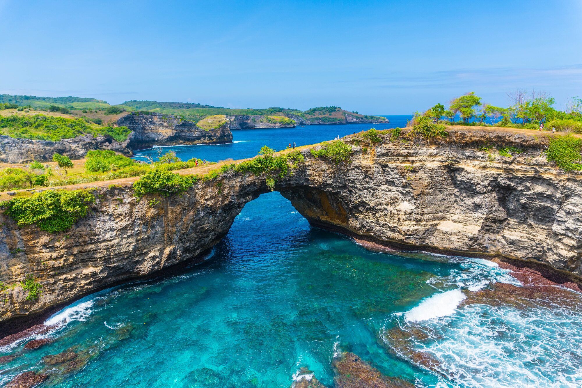 Broken Beach on Nusa Penida, a natural rock arch over a turquoise bay
